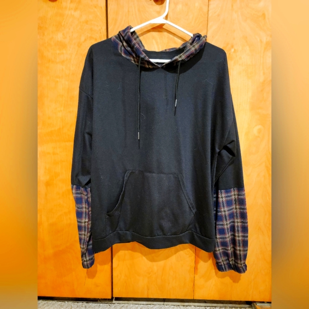 Pullover light weight hoodie with bluish and brown checkers on the arms and hood